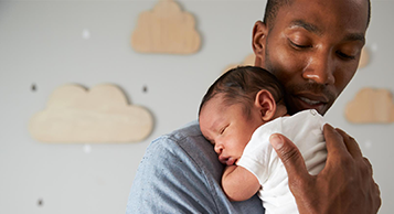 dad holding baby