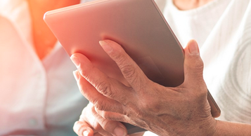 woman holding ipad
